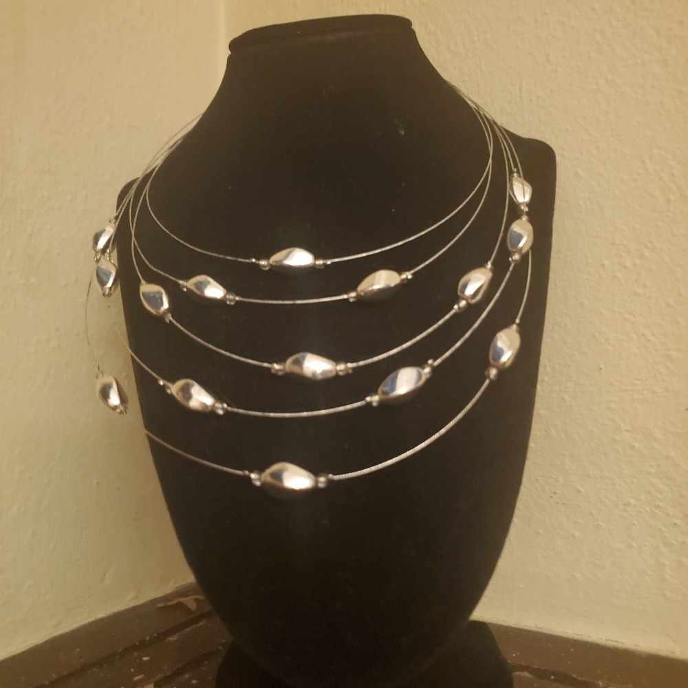 Chicos Baroque beads and fluted metal seeds on a cascade of illusion wire